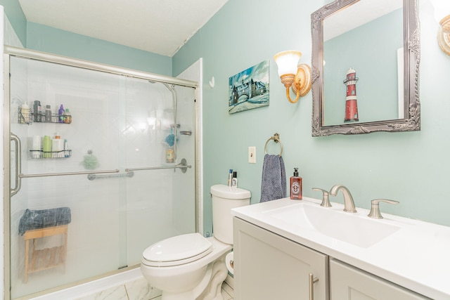 bathroom with vanity, toilet, and an enclosed shower