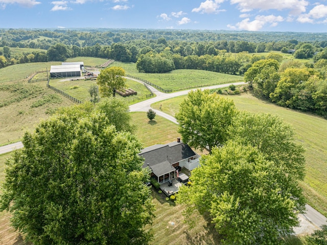 birds eye view of property with a rural view