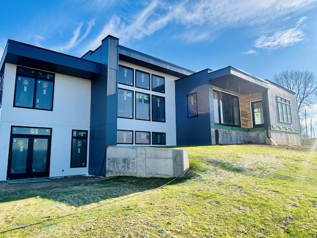 view of side of home featuring a lawn