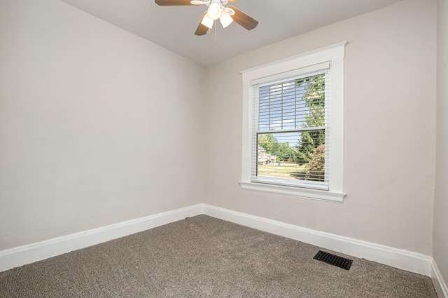 unfurnished room with ceiling fan, carpet, and a healthy amount of sunlight