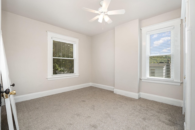 carpeted empty room with ceiling fan