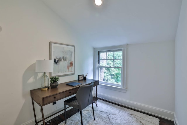 office area with vaulted ceiling and hardwood / wood-style flooring