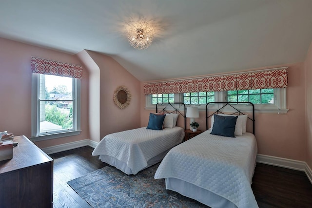 bedroom featuring vaulted ceiling and dark hardwood / wood-style floors