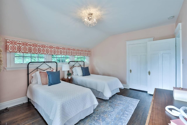 bedroom featuring vaulted ceiling and dark hardwood / wood-style flooring