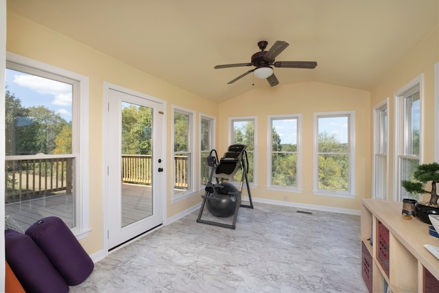 workout room with ceiling fan, plenty of natural light, and lofted ceiling