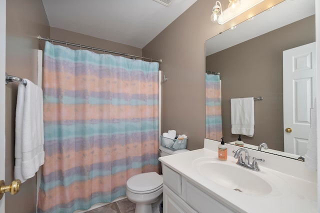 bathroom featuring tile patterned flooring, vanity, toilet, and a shower with curtain