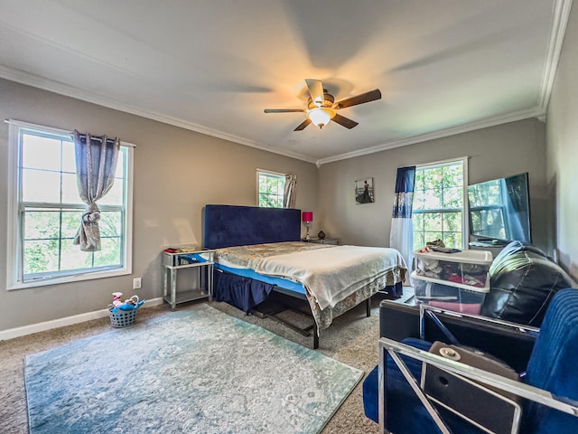 bedroom with ornamental molding, ceiling fan, and carpet floors