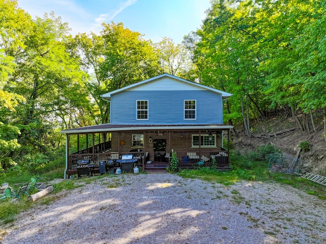 view of front of house featuring an outdoor hangout area, central AC, and a wooden deck