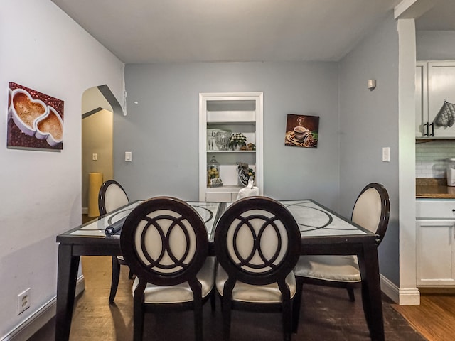 dining room with dark hardwood / wood-style floors