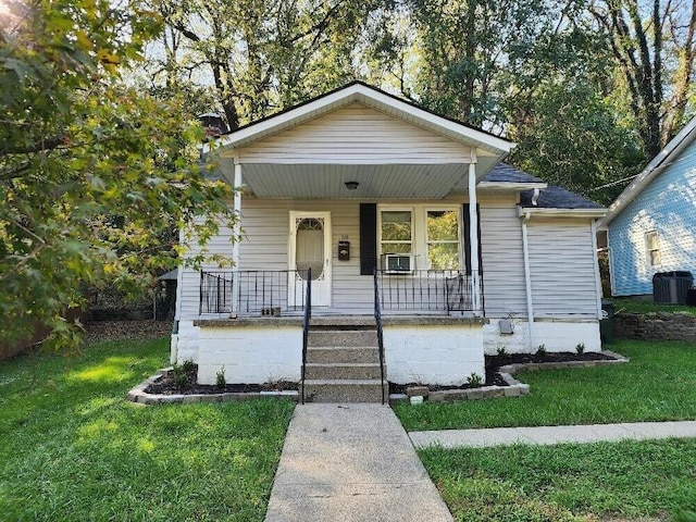 bungalow-style home with central AC, a front lawn, and covered porch