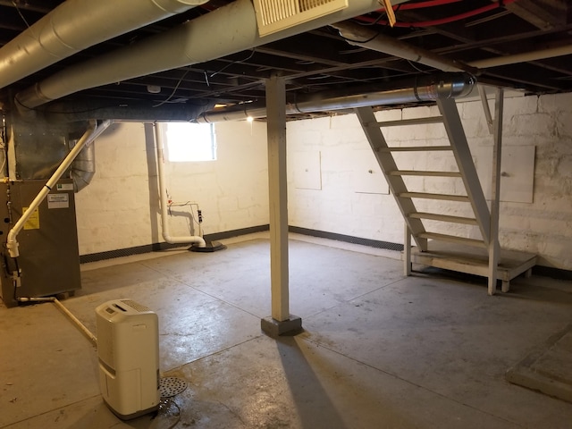 basement featuring heating unit