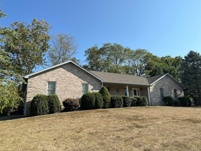 ranch-style home with a front yard