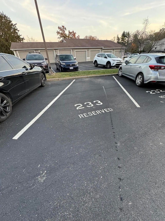 view of parking at dusk