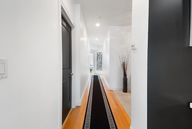 hallway with light wood-type flooring