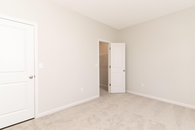 empty room featuring light colored carpet