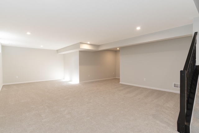 basement with light colored carpet