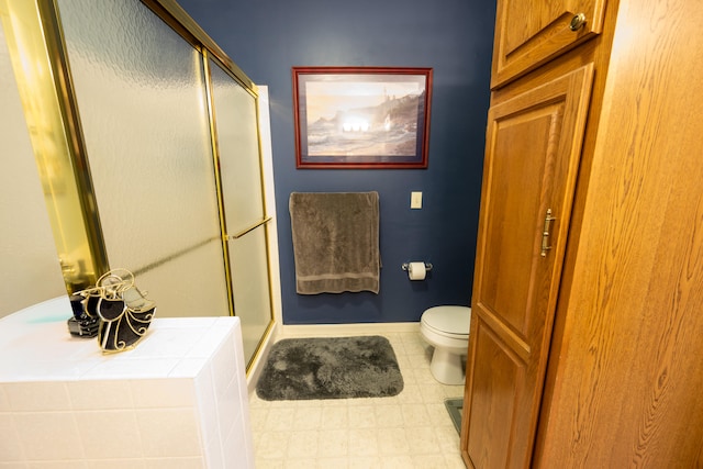 bathroom with toilet and an enclosed shower