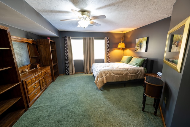 carpeted bedroom with a textured ceiling and ceiling fan