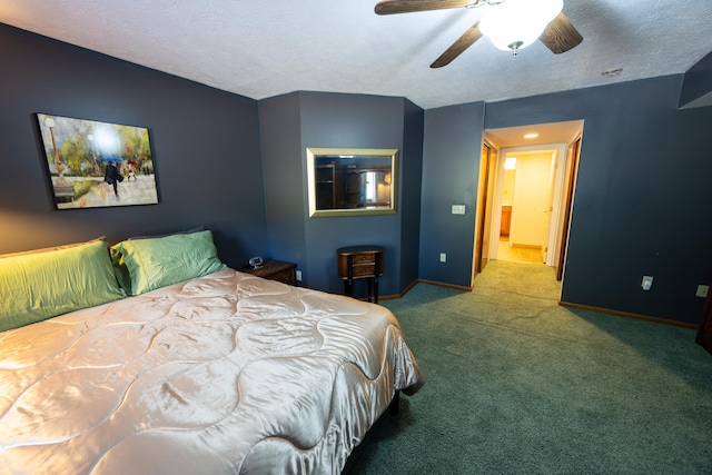 carpeted bedroom with a textured ceiling and ceiling fan