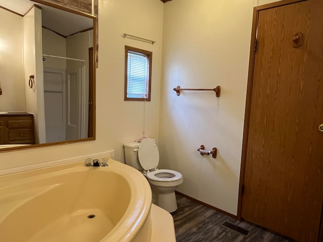 bathroom featuring toilet and hardwood / wood-style flooring