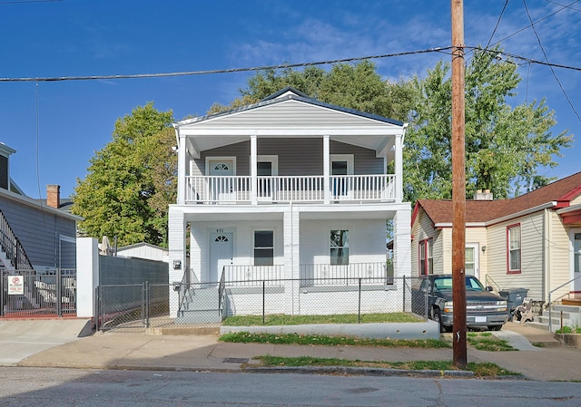 view of front facade with a balcony and a porch