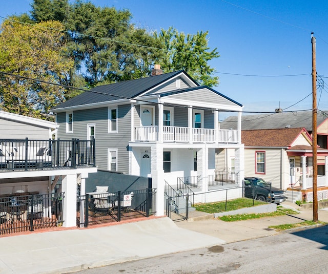 view of front of house with a balcony