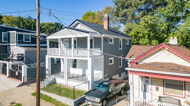 view of front of house featuring a balcony