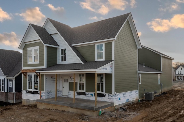 view of front of home featuring central AC unit and a porch