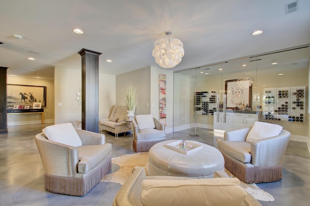 living room featuring ornate columns