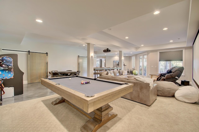 playroom featuring a barn door, a tray ceiling, and billiards