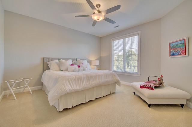 bedroom featuring ceiling fan and carpet