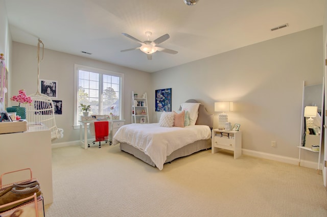 bedroom featuring ceiling fan and light carpet