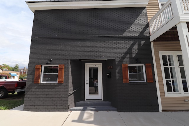 view of front of house featuring a balcony