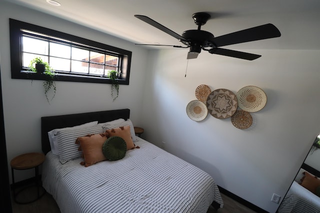 bedroom featuring ceiling fan and hardwood / wood-style flooring