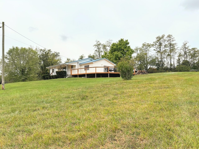 view of yard with a wooden deck