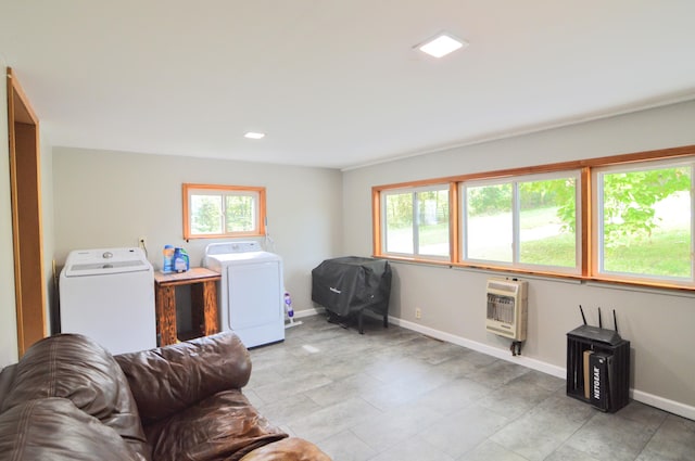 clothes washing area with heating unit and washer and clothes dryer