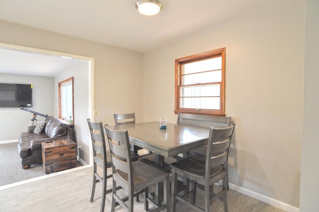 dining space featuring light wood-type flooring