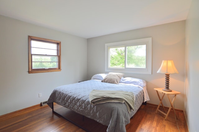 bedroom featuring dark hardwood / wood-style flooring