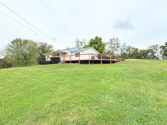 view of yard featuring a wooden deck