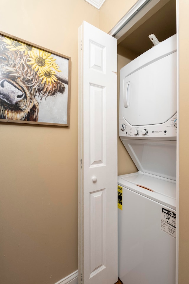 laundry area featuring stacked washer / dryer