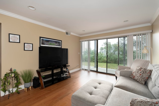 living room featuring wood-type flooring and ornamental molding