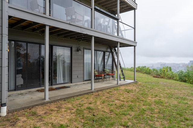 exterior space with a patio and a balcony