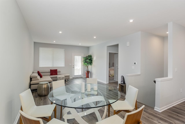 dining area featuring wood-type flooring