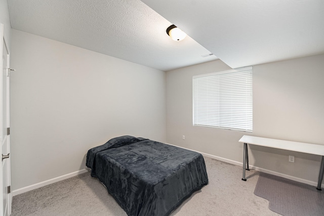 bedroom with light carpet