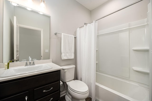 full bathroom with vanity, shower / tub combo, and toilet