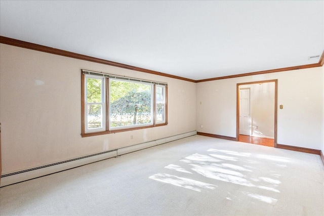 spare room featuring light colored carpet, crown molding, and a baseboard heating unit