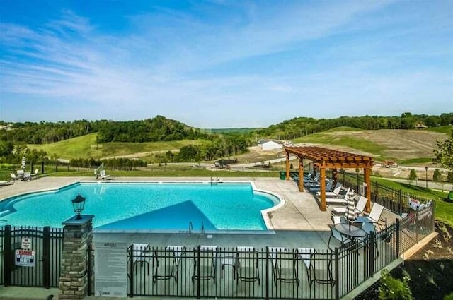 view of swimming pool with a patio