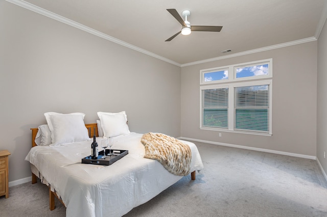 bedroom with ceiling fan, light carpet, and ornamental molding