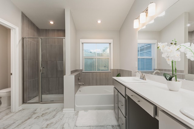 full bathroom with shower with separate bathtub, vanity, and toilet