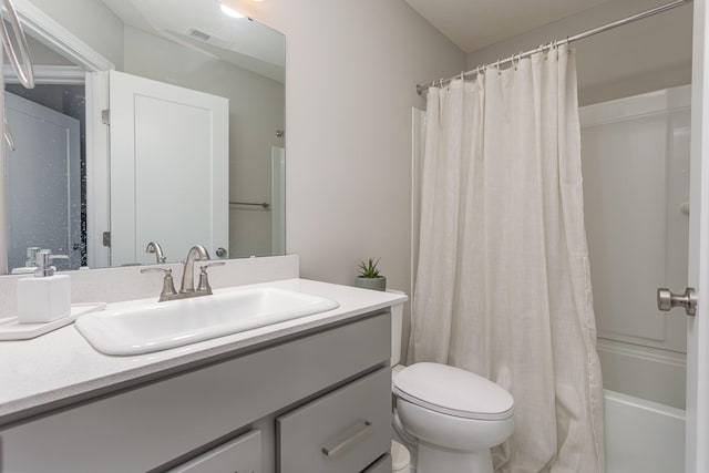 full bathroom featuring vanity, toilet, and shower / tub combo with curtain